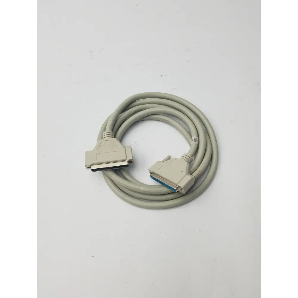 Gray coiled 36-pin centronics to 25-pin db25 lpt cord printer cable with beige connectors and blue internal contacts
