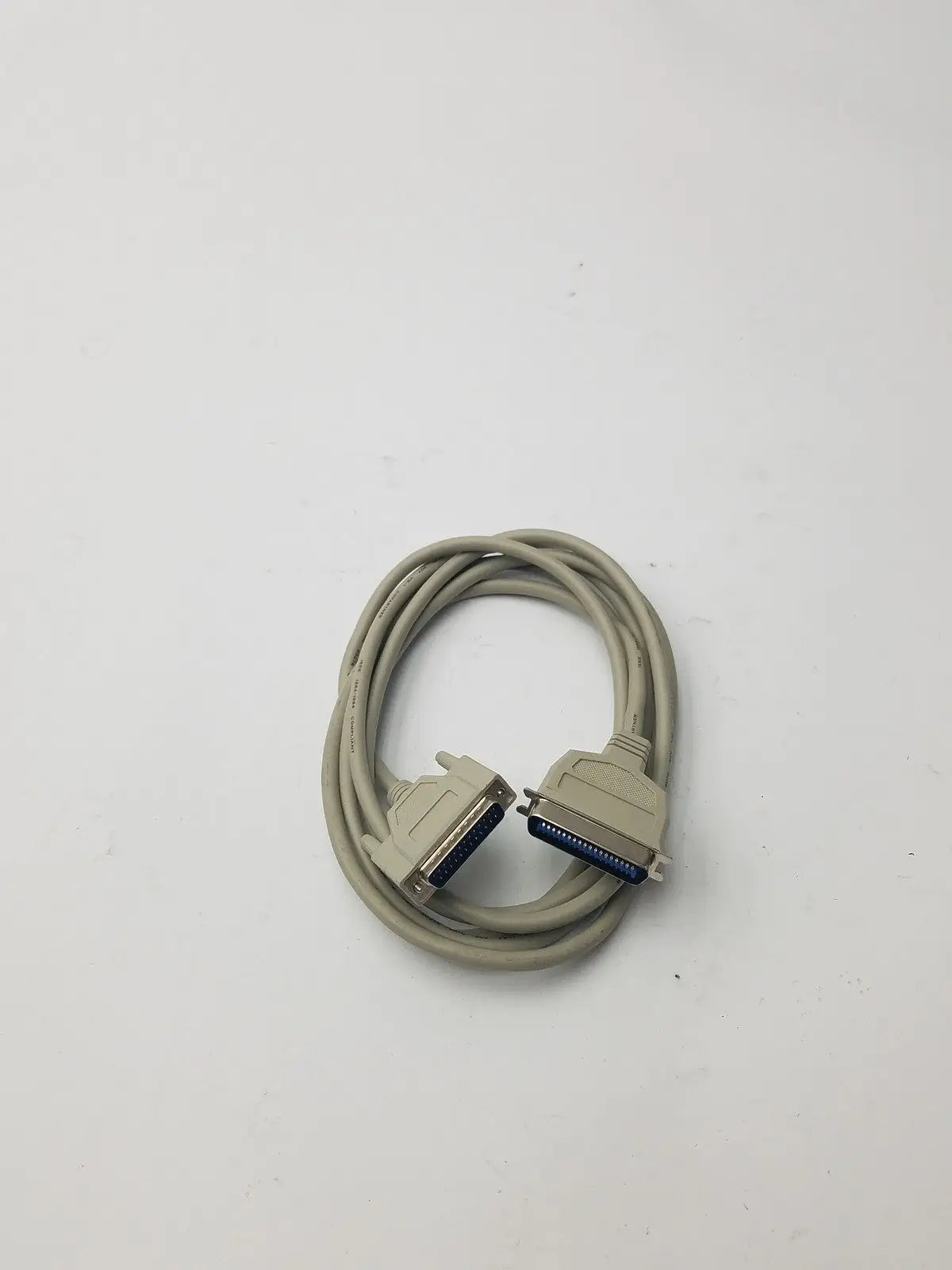 Beige coiled 36-pin male to 25-pin male parallel printer cable with blue contact connectors for printer connection