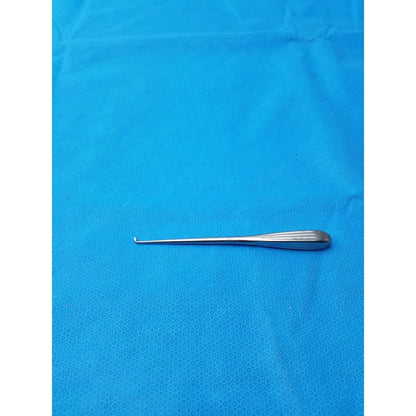 Silver spratt bone curette with slender curved hook and textured handle made of stainless steel for surgical use