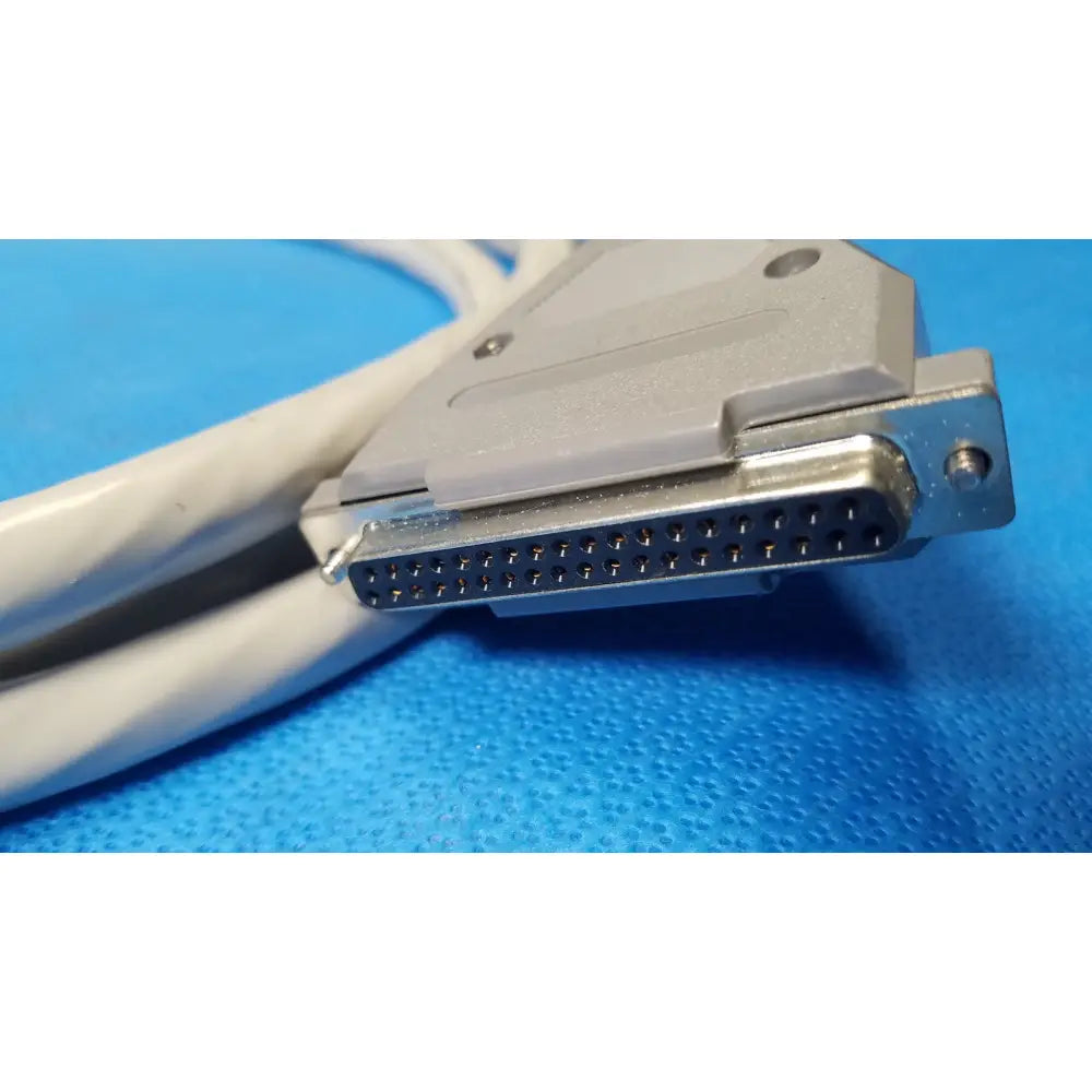 Gray d-sub 25-pin female pin connector with metallic contacts and white cable for pin connector data cable use