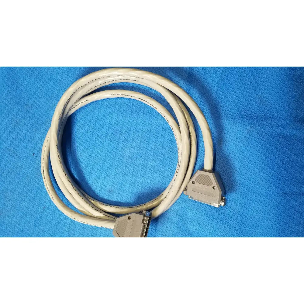 Beige coiled 37 male pin to 37 female pin connector data cable with metallic d-sub female pin connectors