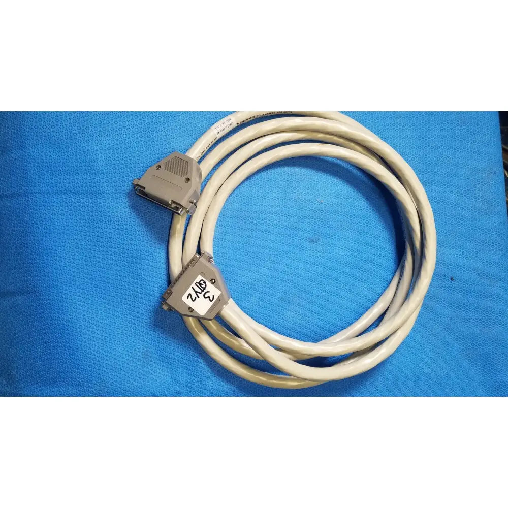 Beige coiled 37 male to 37 female pin connector data cable with gray plastic connectors and labeled 3 2/16 female pin connector