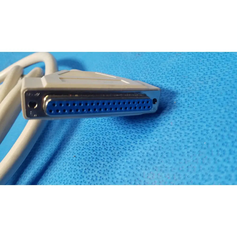 Beige db-25 serial cable with metallic blue pin male connector and plastic housing for female connector cable use