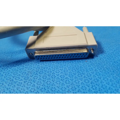Beige plastic db-25 pin male serial connector with metallic pins and screw fastener for female connector cable use