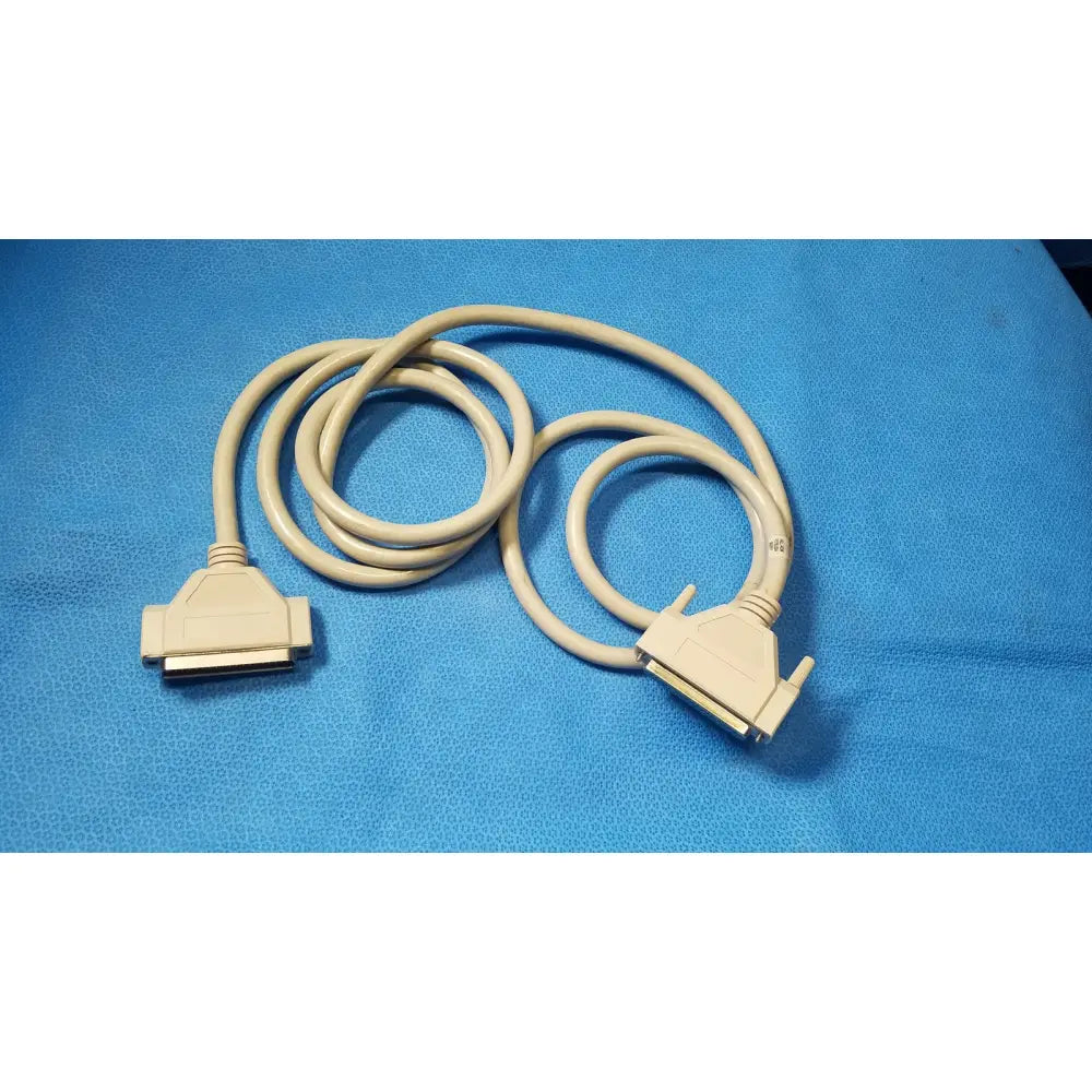 Beige coiled printer cable with two db-25 pin male and pin female connectors for female connector cable use