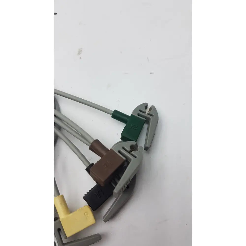 Gray and green plastic-handled wire cutters with adjustable jaws for compatible ecg telemetry 5 lead grabbers 394111-011