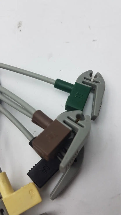 Gray plastic pipe wrenches with green brown and black connectors for compatible ecg telemetry 5 lead grabbers