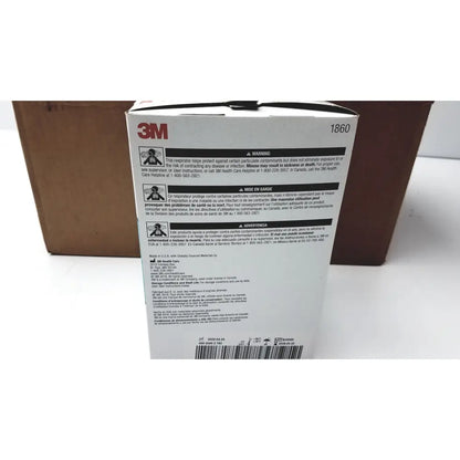 White cardboard box with black text and 3m logo labeled as 3m 1860 particulate respirator and surgical mask for reuse medical use