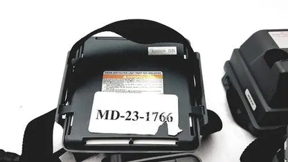 Black plastic headband with white label md-23-1766 and orange warning sticker on 3m 520-03-63 air-mate hepa filter unit battery