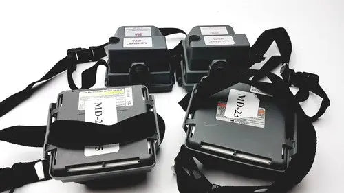Black md240 devices with adjustable straps attached to 3m 520-03-63 air-mate hepa filter unit battery pack