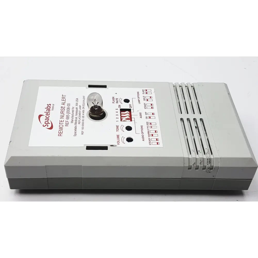 Gray plastic spacelabs remote nurse alert device with control buttons shown alongside 3m 60923 half mask respirator