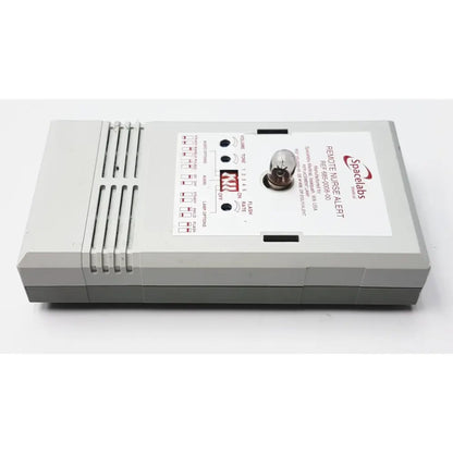 Gray plastic remote nurse alert device with white label and illuminated bulb for 3m 60923 half mask respirator use
