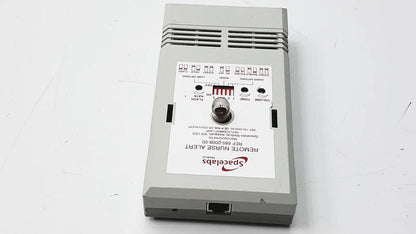 Gray rectangular electronic device with spaceslabs logo labeled remote nurse alert shown with 3m 60923 half mask respirator