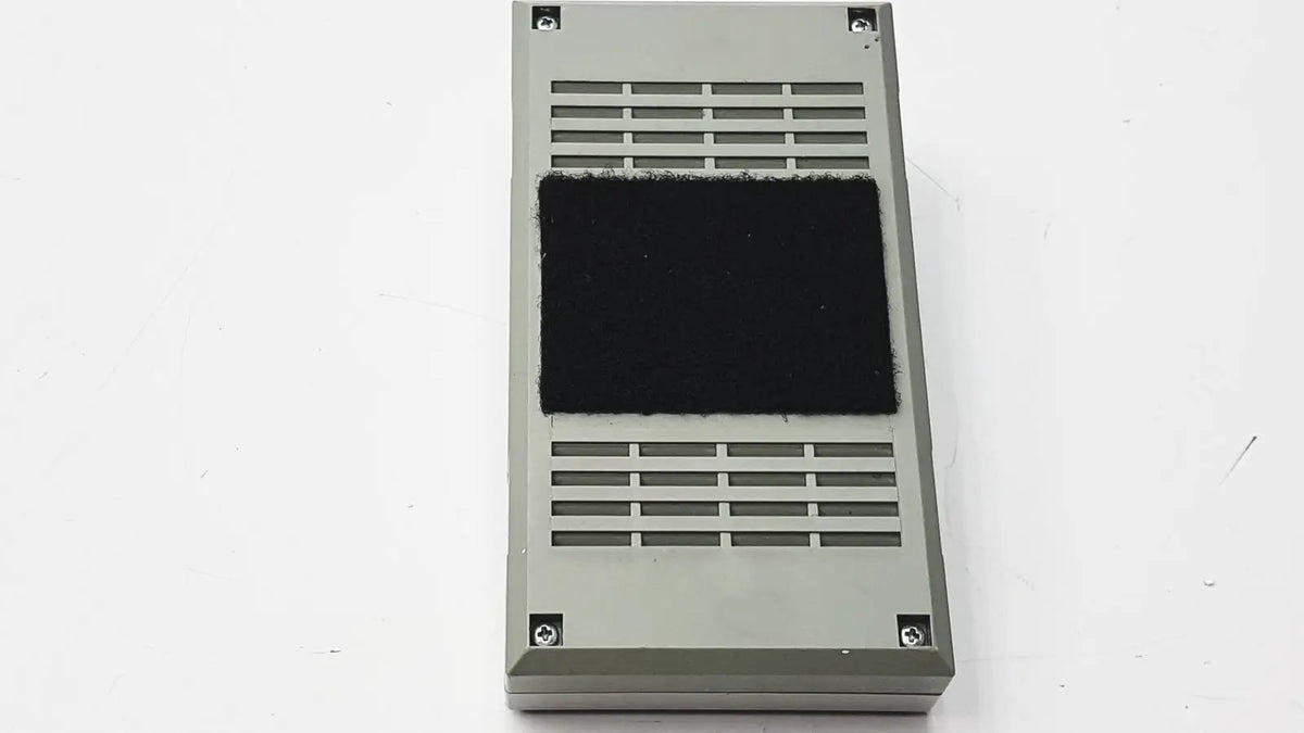Gray rectangular air filter with black foam insert and slotted vents for 3M 60923 half mask respirator