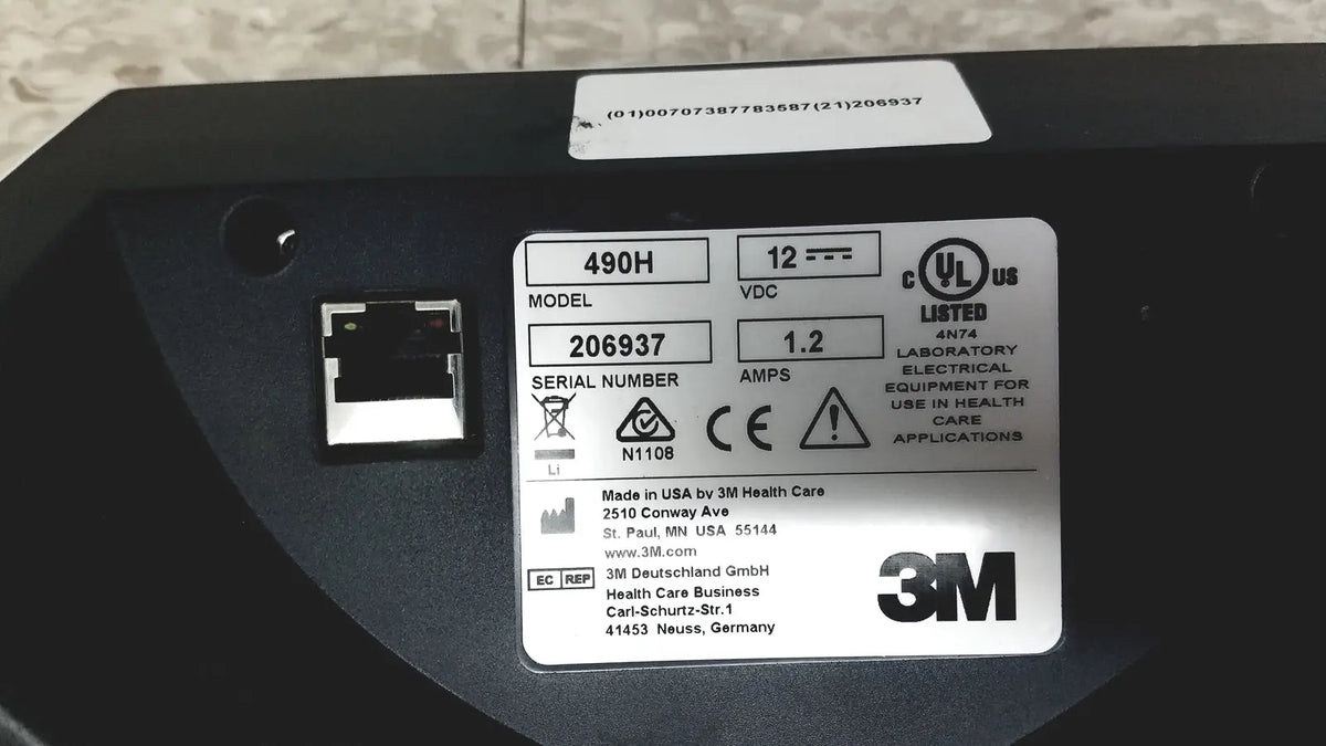 Black 3m attest auto-reader 490h incubator showing electrical equipment with silver label of specifications and certification marks