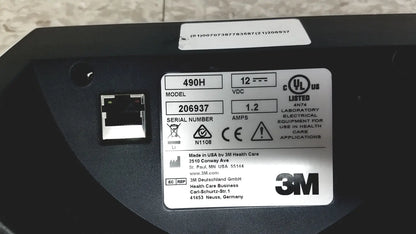 Black 3m attest auto-reader 490h incubator showing electrical equipment with silver label of specifications and certification marks