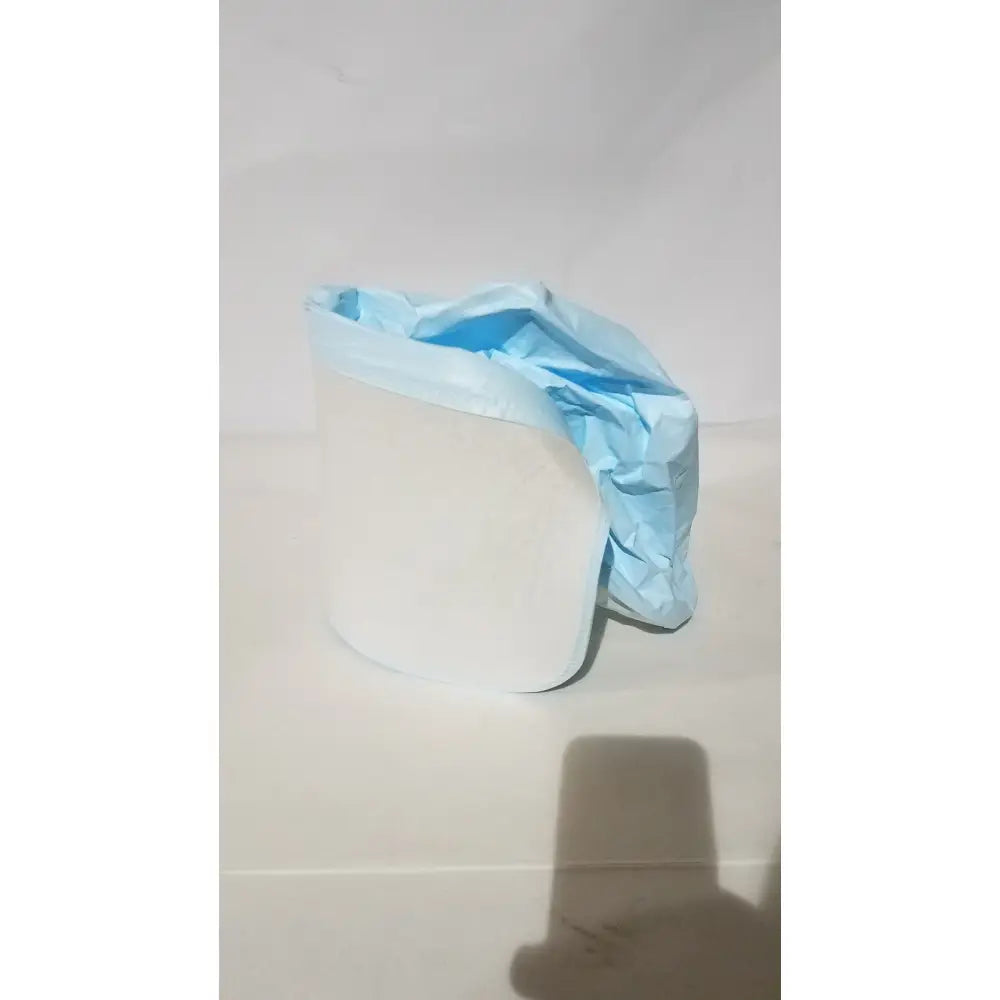 A crumpled light blue be-12lb blue respirator headcover draped over a white cylindrical object for PAPR systems