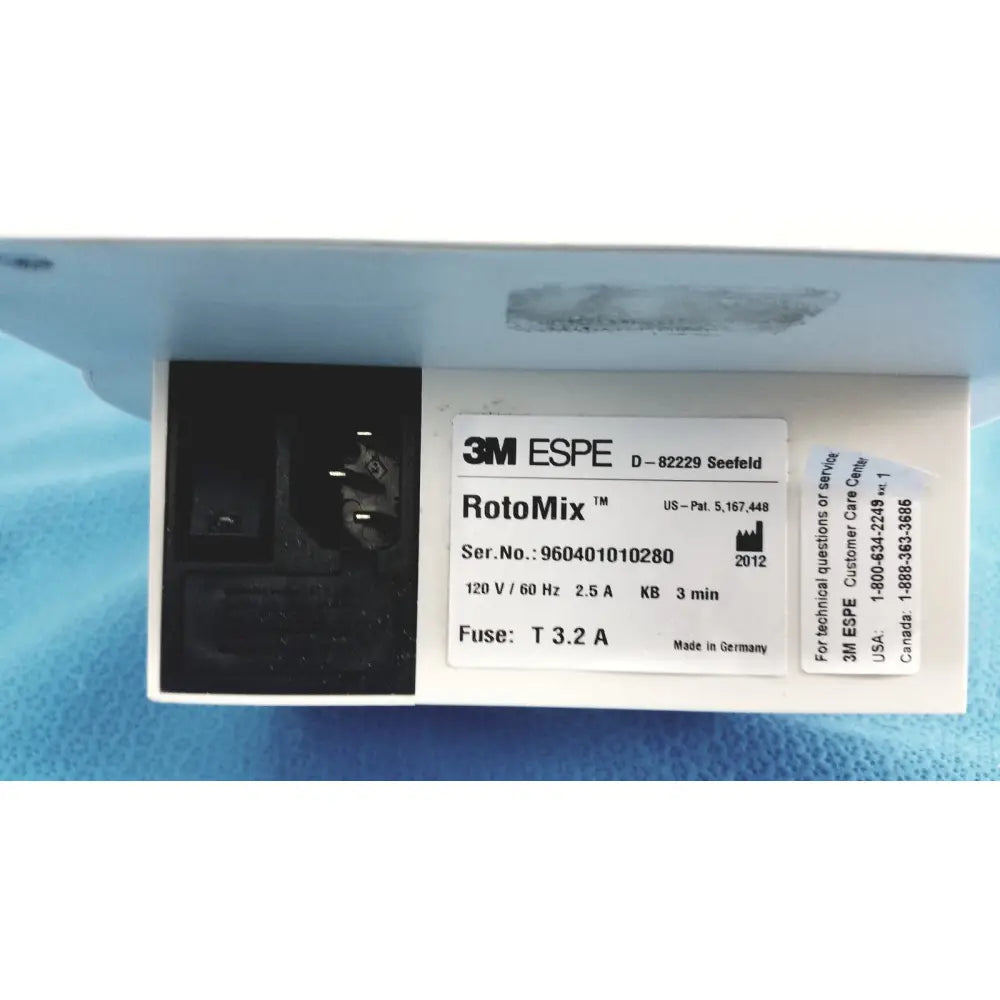 White plastic 3m espe rotomix capsule mixing unit 120v with black electrical connector and serial number label visible