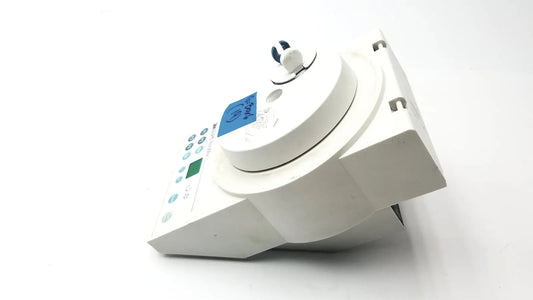 White plastic medical device 3M ESPE RotoMix with circular top blue digital display and multiple control buttons for reuse medical applications