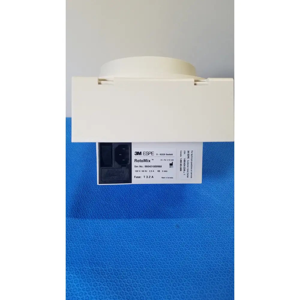 White 3m espe rotomix rotating mixing device with rectangular base and circular top featuring printed specifications