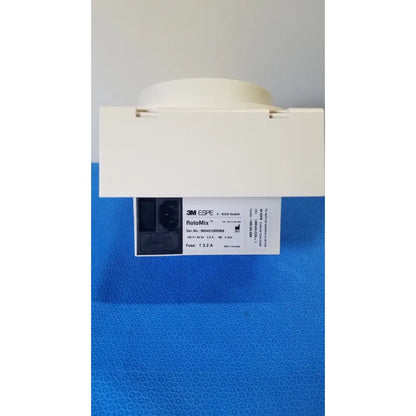 White 3m espe rotomix rotating mixing device with rectangular base and circular top featuring printed specifications