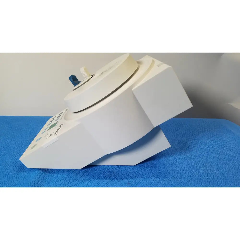 White laboratory centrifuge 3M ESPE RotoMix rotating mixing device with blue knob and control panel