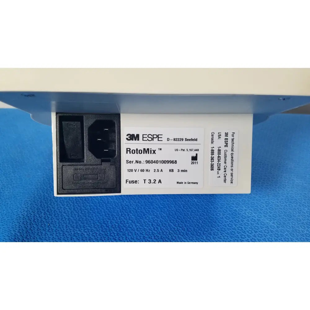3m espe rotomix rotating mixing device with black power inlet and white specification label on the back side