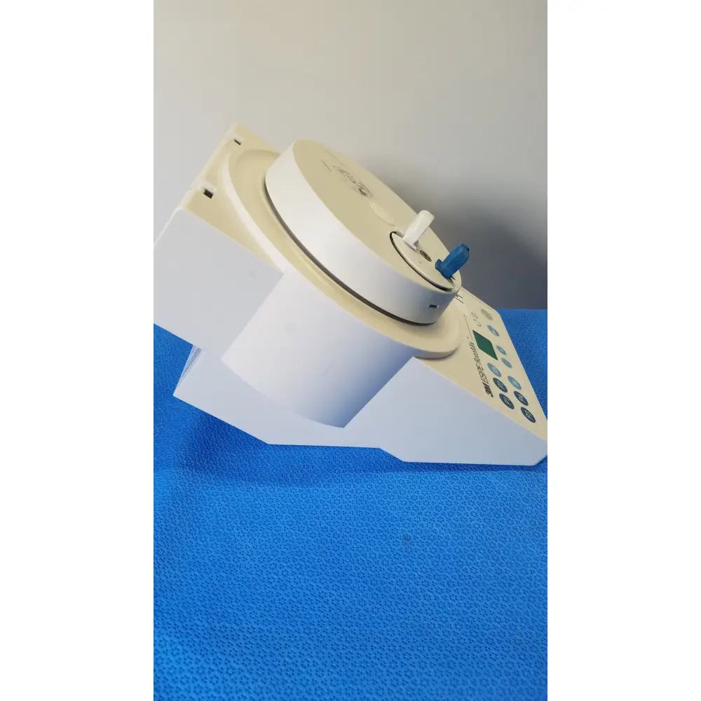 White plastic 3m espe rotomix rotating mixing device with blue handle and digital control panel for lab use