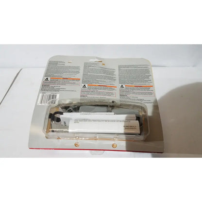 A black and silver electric drill driver in its original packaging next to a 3m half face reusable respirator medium valved