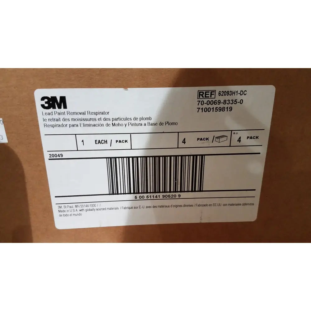 White rectangular label with black text and barcode on the back of 3M half face reusable respirator medium valved for paint removal