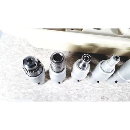 A set of five metallic drill bits with white handles for 3m maxi driver ii autoclave tray air powered instruments set