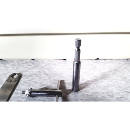 A sleek metallic socket wrench with hexagonal drive head and polished chrome finish for 3m driver ii autoclave tray air set