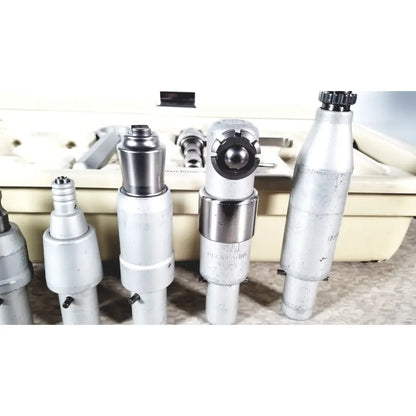 Silver metallic 3m maxi driver ii autoclave dental handpiece with black rubber grip and engraved markings for tray air powered use