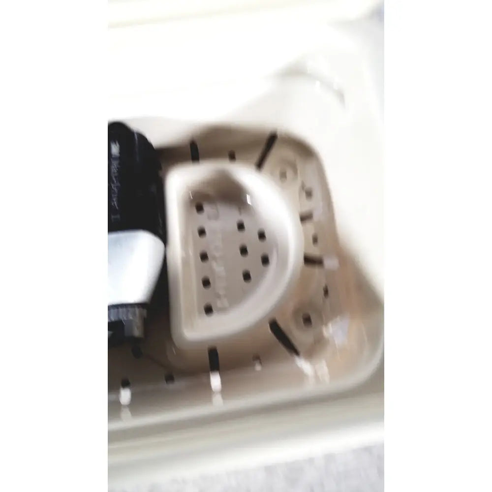 Beige plastic dish rack with curved perforated basin and black support rods for 3m driver ii autoclave tray air use