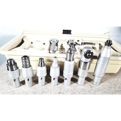Set of seven silver metal 3m maxi driver ii autoclave tray air powered handpieces with attachments and beige case