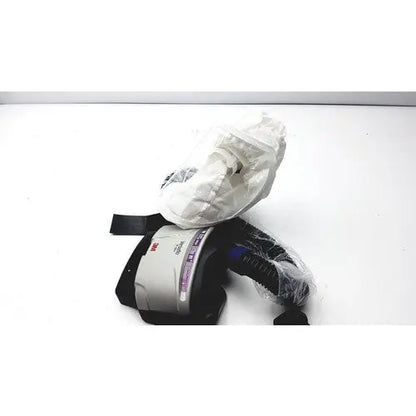 3m papr versaflo blower mx2169225 respirator mask with black straps gray housing partially wrapped in clear plastic