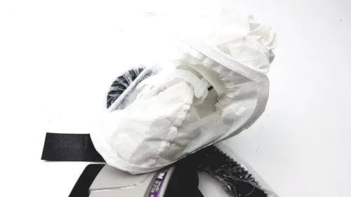 White protective shoe cover with black elastic strap and transparent plastic overlay for 3m papr versaflo blower mx2169225