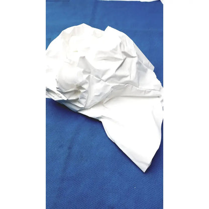 A crumpled white paper bag on a blue surface beside a 3m s-533s high durability hood with integrated suspension