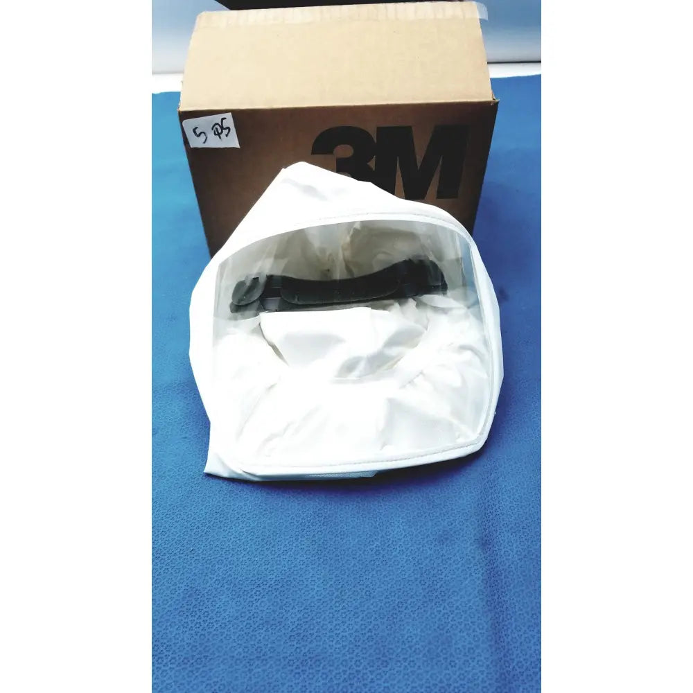 White protective face shield with transparent visor and black adjustable headband in 3M s-533s high durability hood box