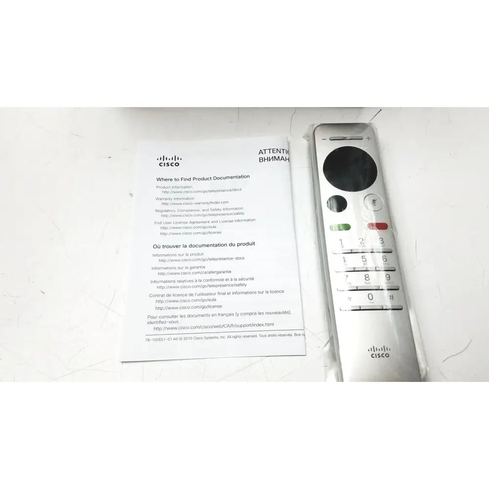 Silver cisco remote control with black circular button and colored keys shown with 3m steri drape 64x41 expiry 2028 for reuse medical use
