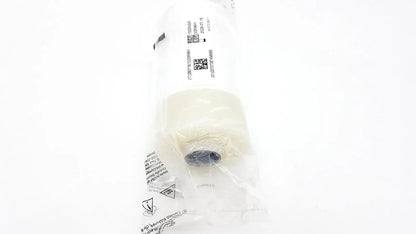 A white cylindrical filter element sealed in clear plastic packaging for 3m steri-drape roll prep drape 1000nsr