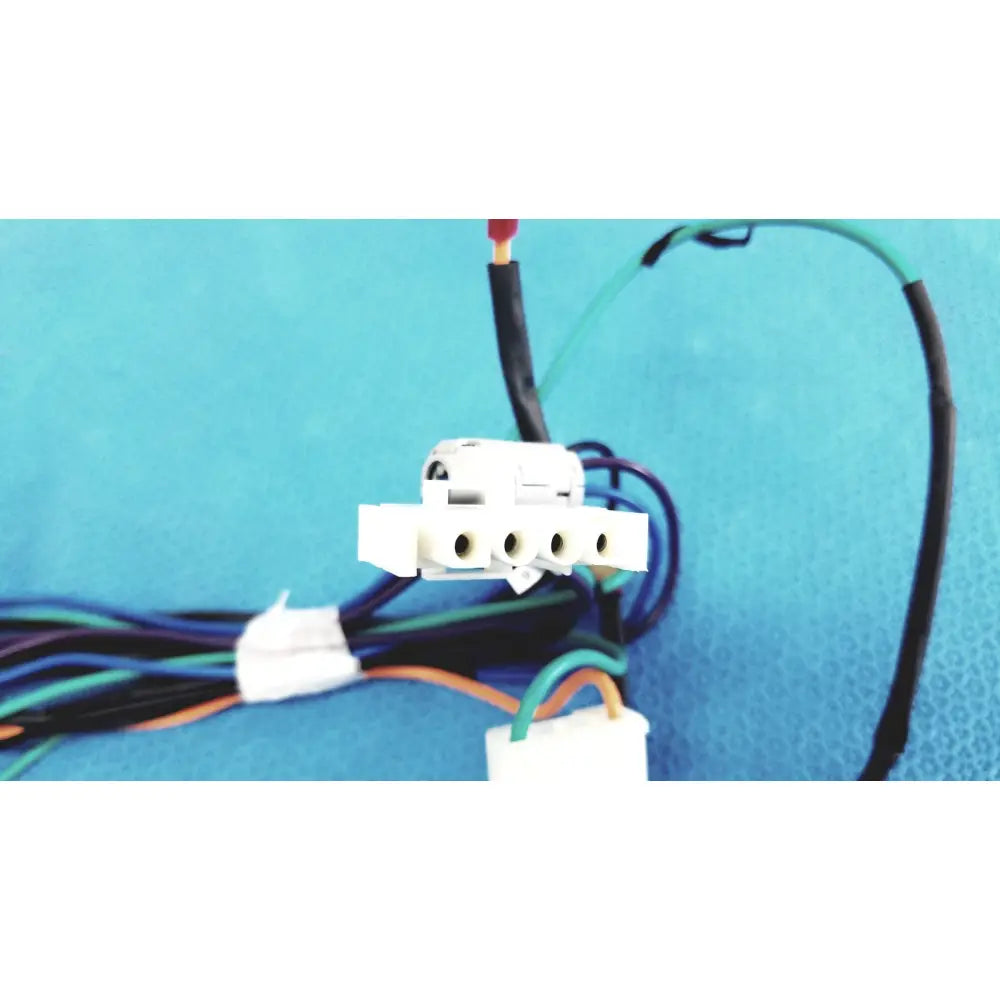 White plastic multi-pin connector wire harness with multiple circular ports and attached multi-colored wire harness cables