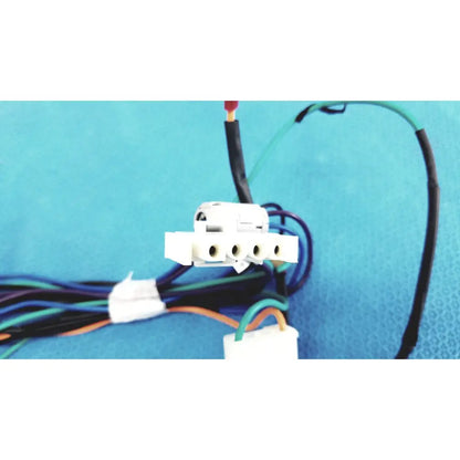 White plastic multi-pin connector wire harness with multiple circular ports and attached multi-colored wire harness cables