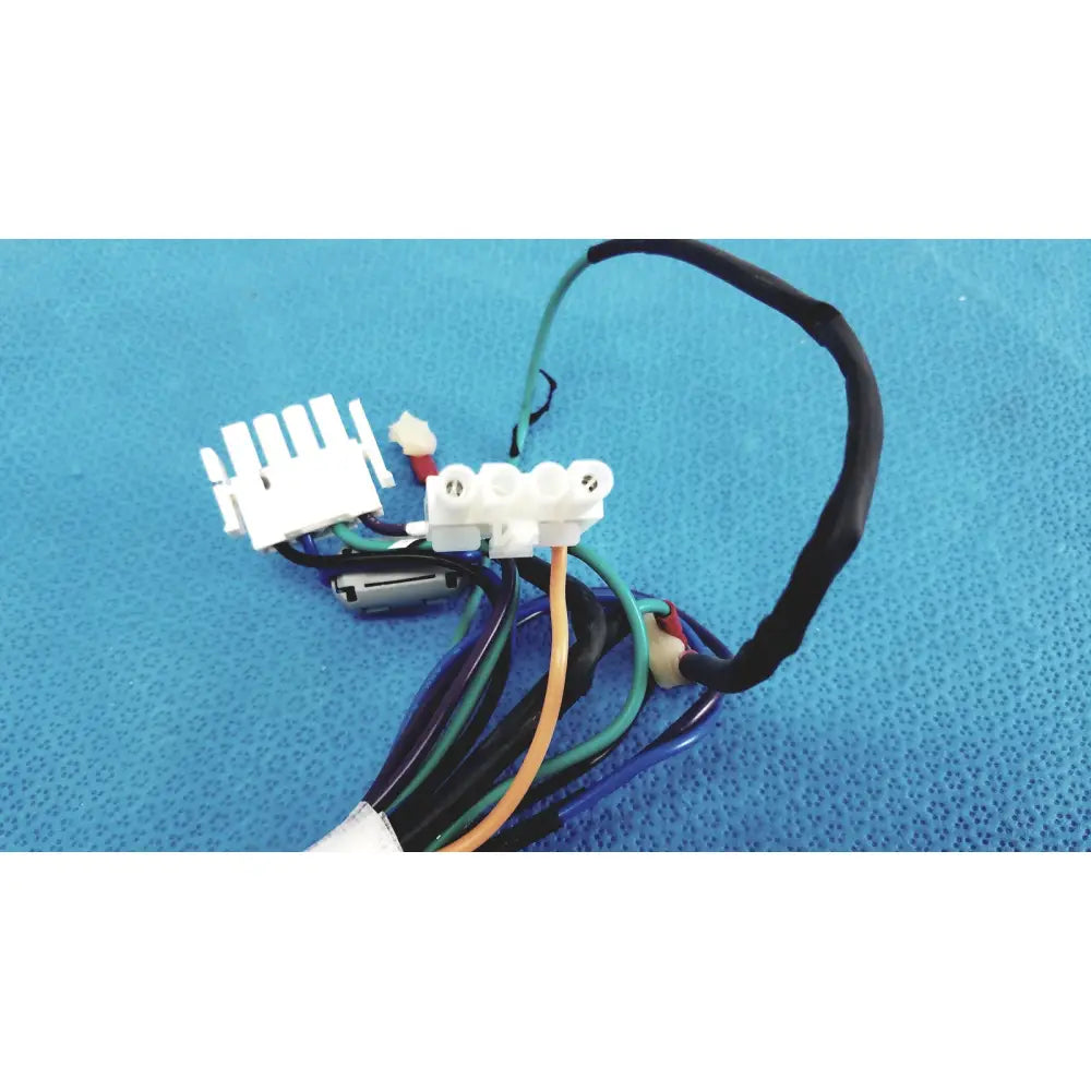 A bundle of multicolored connector wire harness cables with white plastic connectors and a small cylindrical component