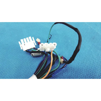 A bundle of multicolored connector wire harness cables with white plastic connectors and a small cylindrical component