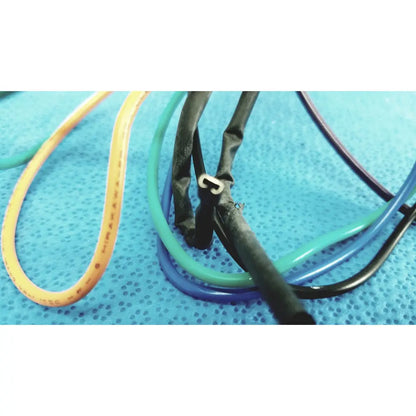 A bundle of colorful yellow green blue and black flexible tubing in 4 multi-pin connector wire harness cables