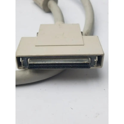 Beige rectangular 50-pin male hard drive scsi-ii cable connector with metallic contacts and plastic housing