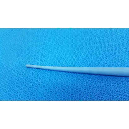 A slender off-white plastic maloney tapered esophageal bougie 42fr with a tungsten-filled tapered tip on a blue surface