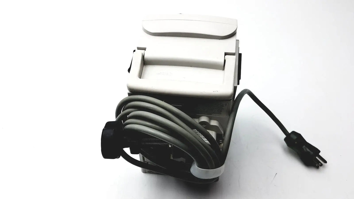 White plastic electric paper cutter with black power cord and plug for medical isolation gown level 2 cutting tasks