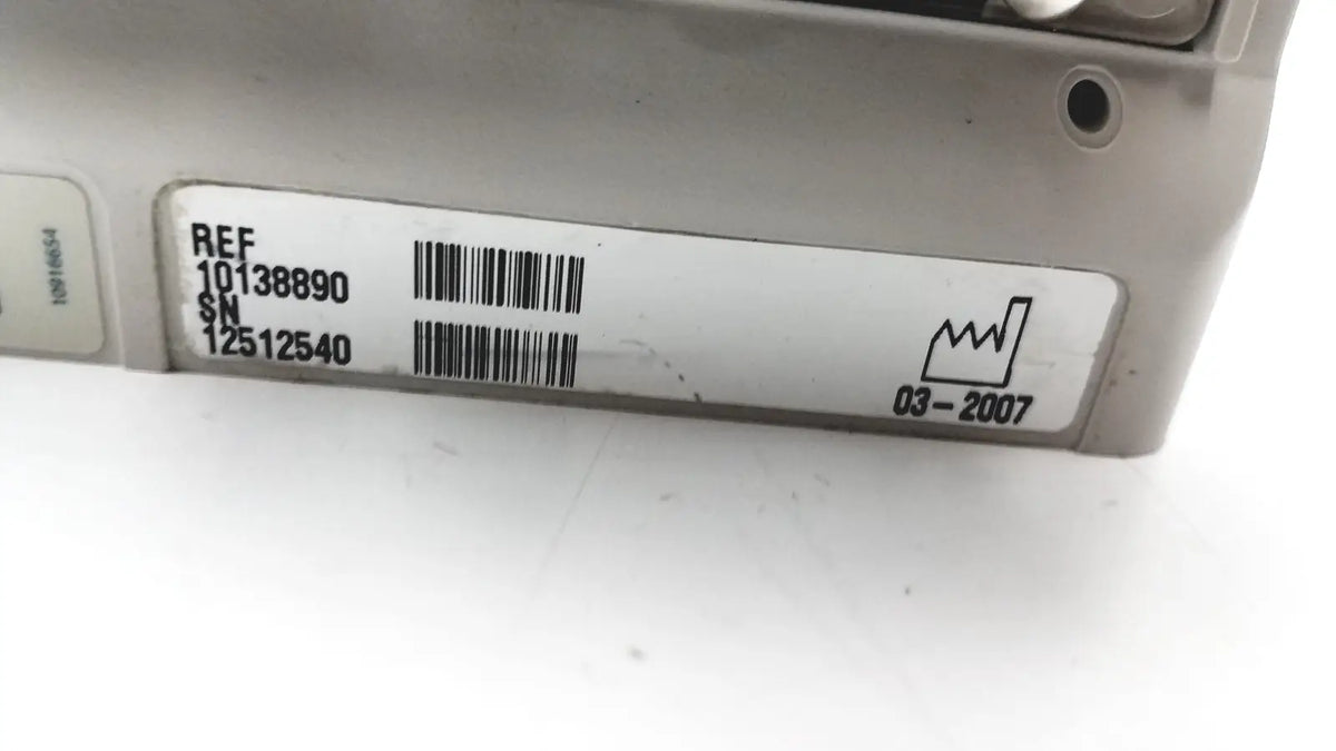 Silver metal engine control unit with label shown alongside 60 count medical isolation gown level 2 product details